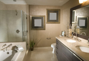 Bathroom with warm earth tones and dark wood cupboards